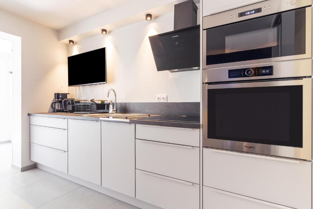 Kuchyňa alebo kuchynka v ubytovaní La Bastide de la Plage - Garage privé
