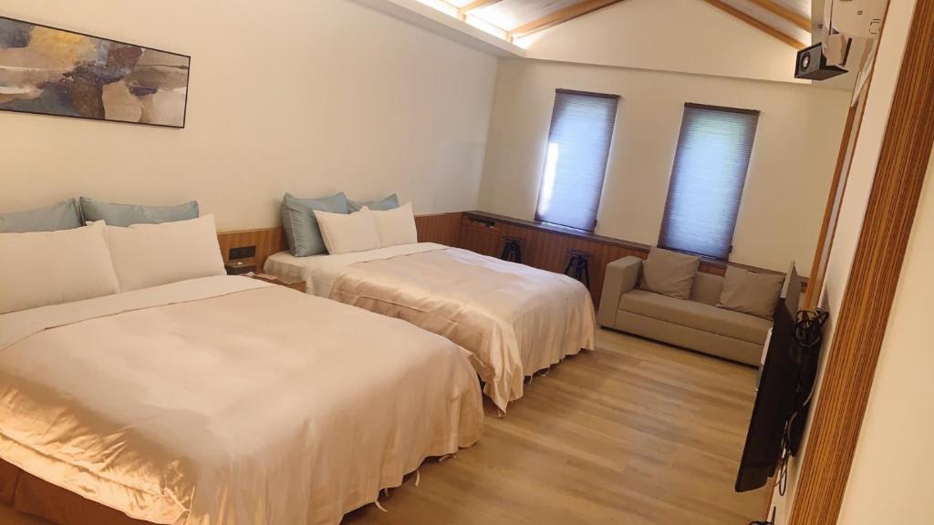 Postel nebo postele na pokoji v ubytování Shu Xin Motel