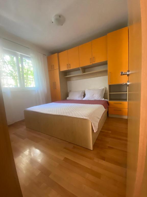 Posteľ alebo postele v izbe v ubytovaní Apartmani IvaMia