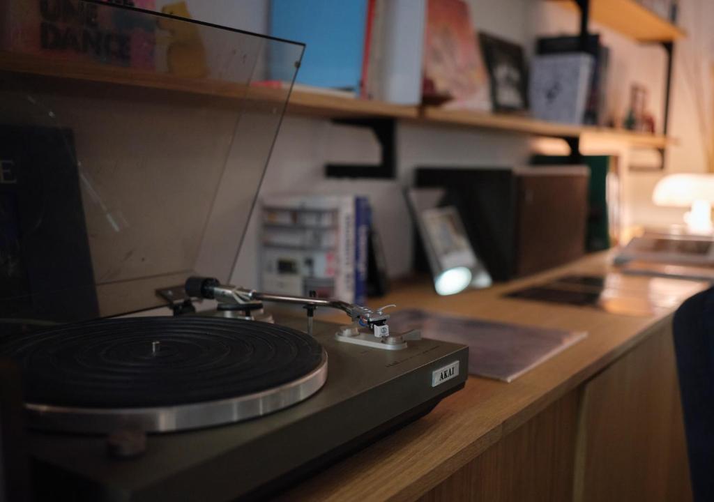 a cd sitting on top of a counter at Maison Juste in Marseille