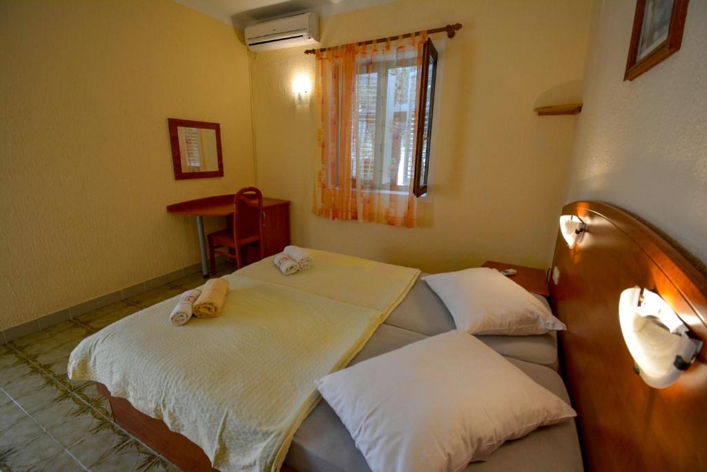 Postel nebo postele na pokoji v ubytování Bungalow Olivtree