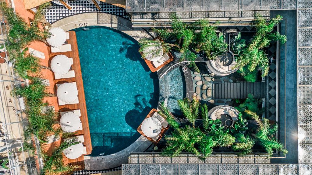 an overhead view of a swimming pool at a resort at Genesis Hotel&Spa Alaçatı in Alacati