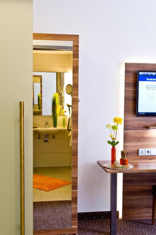 TV a/nebo společenská místnost v ubytování Wohlfühl-Hotel Neu Heidelberg