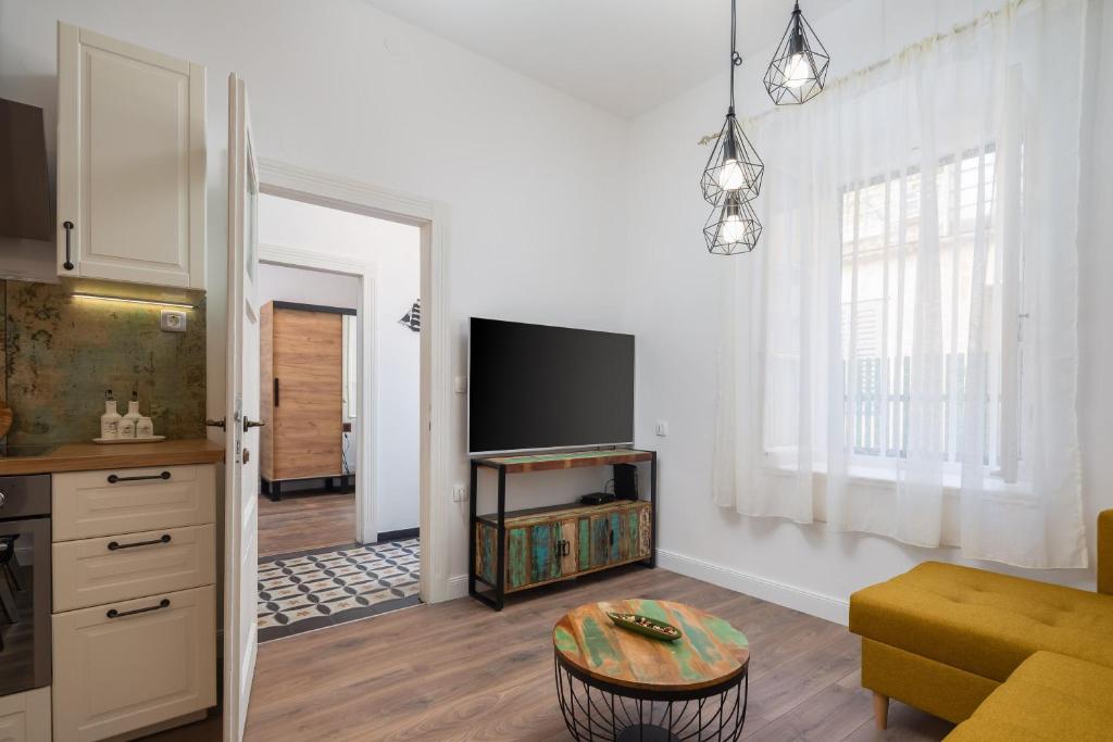 Televízia a/alebo spoločenská miestnosť v ubytovaní Luxury apartment Toni