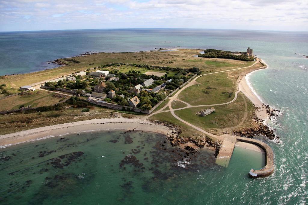 an aerial view of an island in the ocean at Les Maisons de Tatihou in Saint-Vaast-la-Hougue