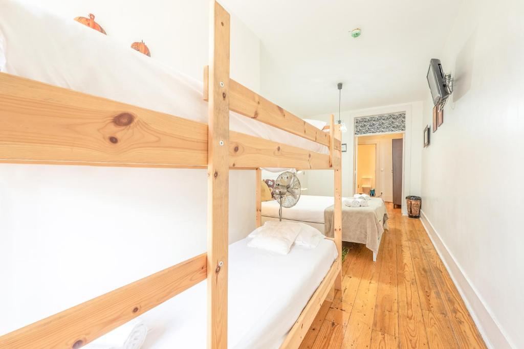 a bedroom with two bunk beds in a room at Happy at Chiado in Lisbon