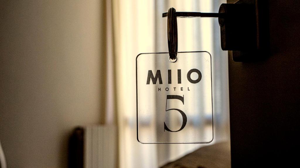 a sign on a door that reads milo nuclei at MIIO HOTEL in San Vincenzo
