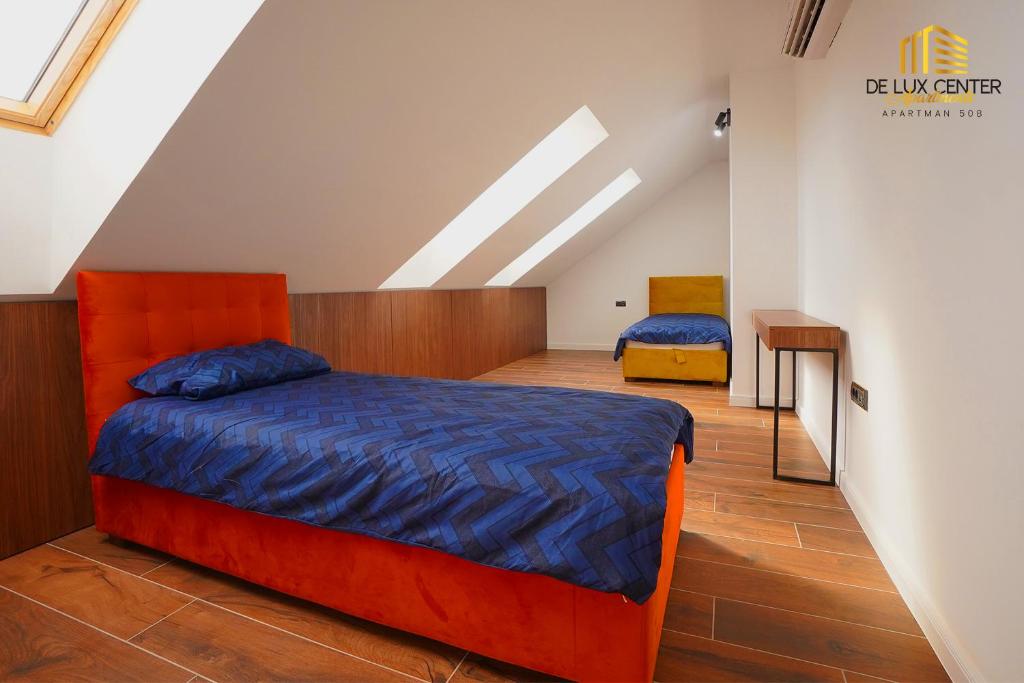 Postel nebo postele na pokoji v ubytování DeLux Center Apartments Inđija
