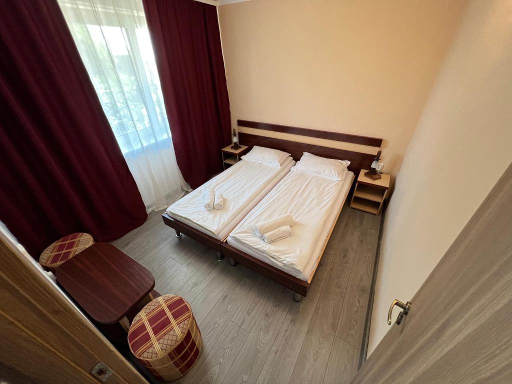 Postel nebo postele na pokoji v ubytování Claudia