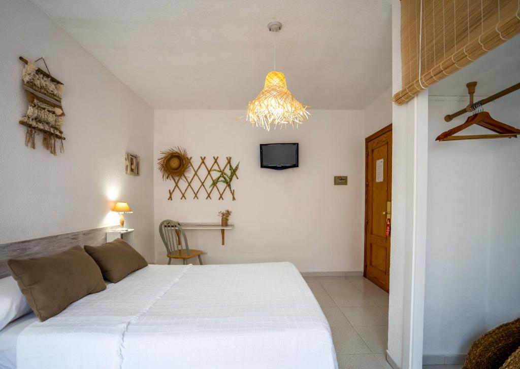 Postel nebo postele na pokoji v ubytování LOS NAREJOS Hotel