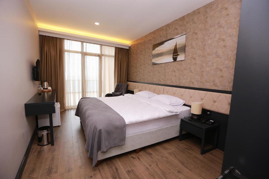 Postel nebo postele na pokoji v ubytování PENTAHOR HOTEL