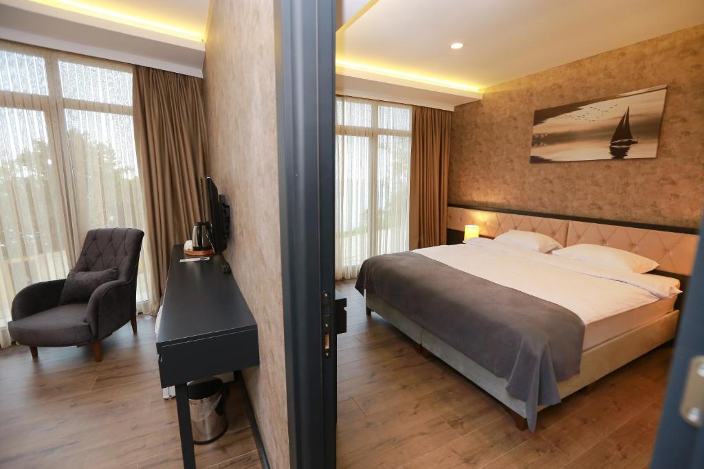Postel nebo postele na pokoji v ubytování PENTAHOR HOTEL