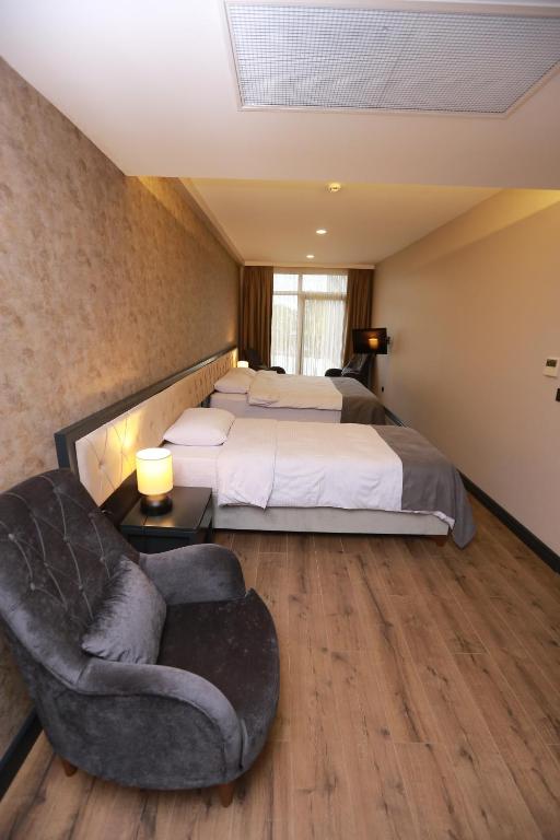 Postel nebo postele na pokoji v ubytování PENTAHOR HOTEL