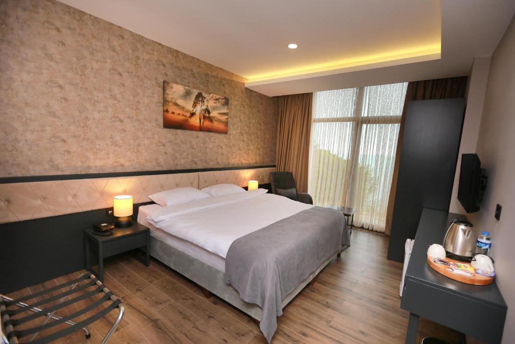 Postel nebo postele na pokoji v ubytování PENTAHOR HOTEL