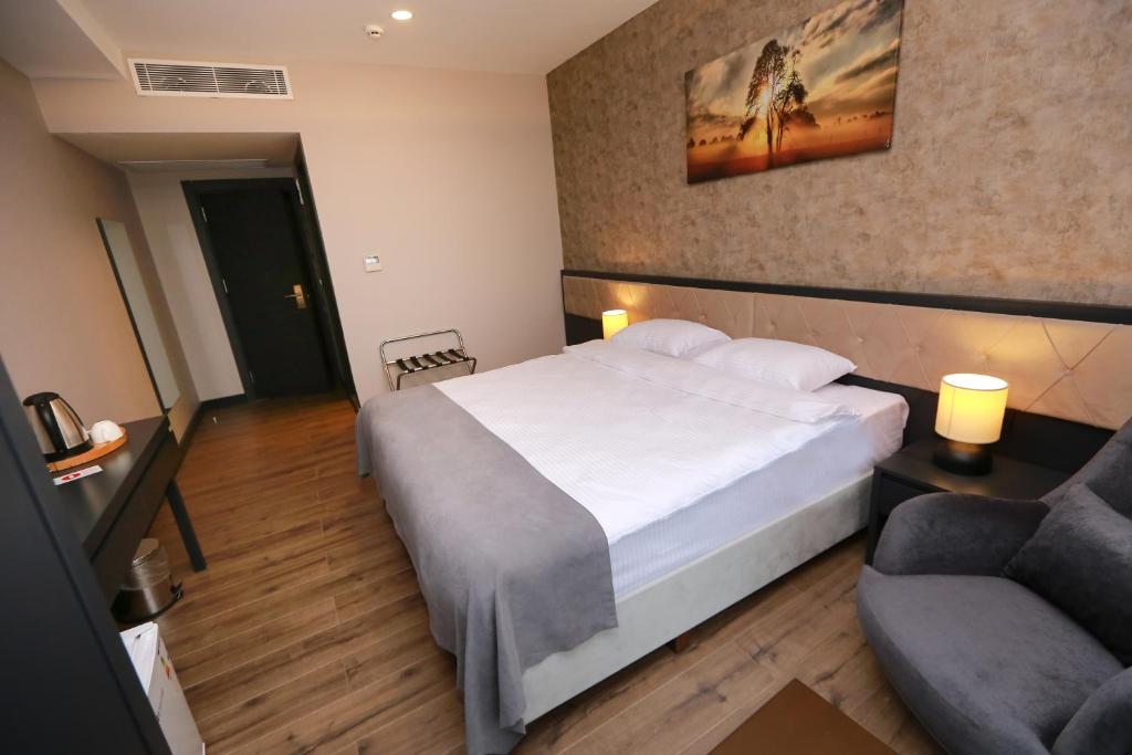 Postel nebo postele na pokoji v ubytování PENTAHOR HOTEL