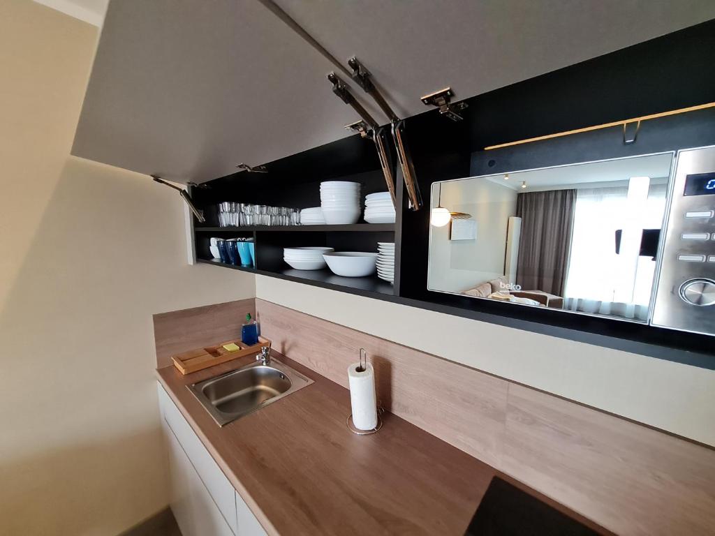Kuchyňa alebo kuchynka v ubytovaní Apartament Alicia Aqua Resort E 214