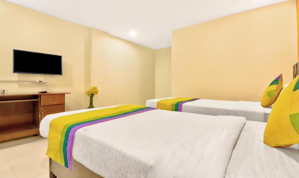 Postel nebo postele na pokoji v ubytování Itsy Hotels Carnival Inn