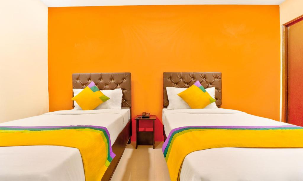 Postel nebo postele na pokoji v ubytování Itsy Hotels Carnival Inn
