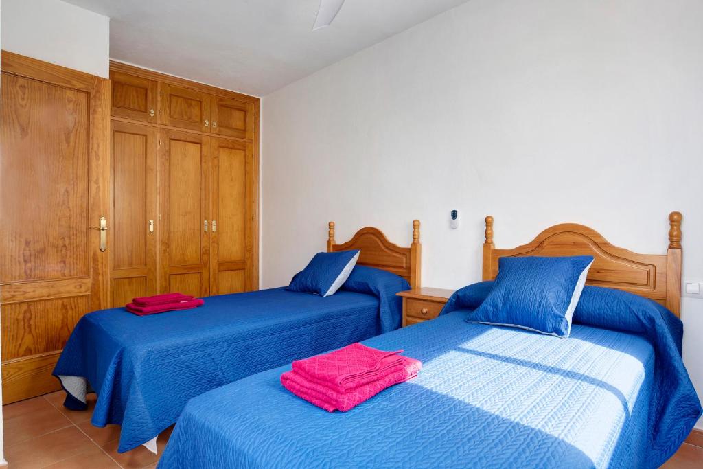 Posteľ alebo postele v izbe v ubytovaní Apartamento Azucenas