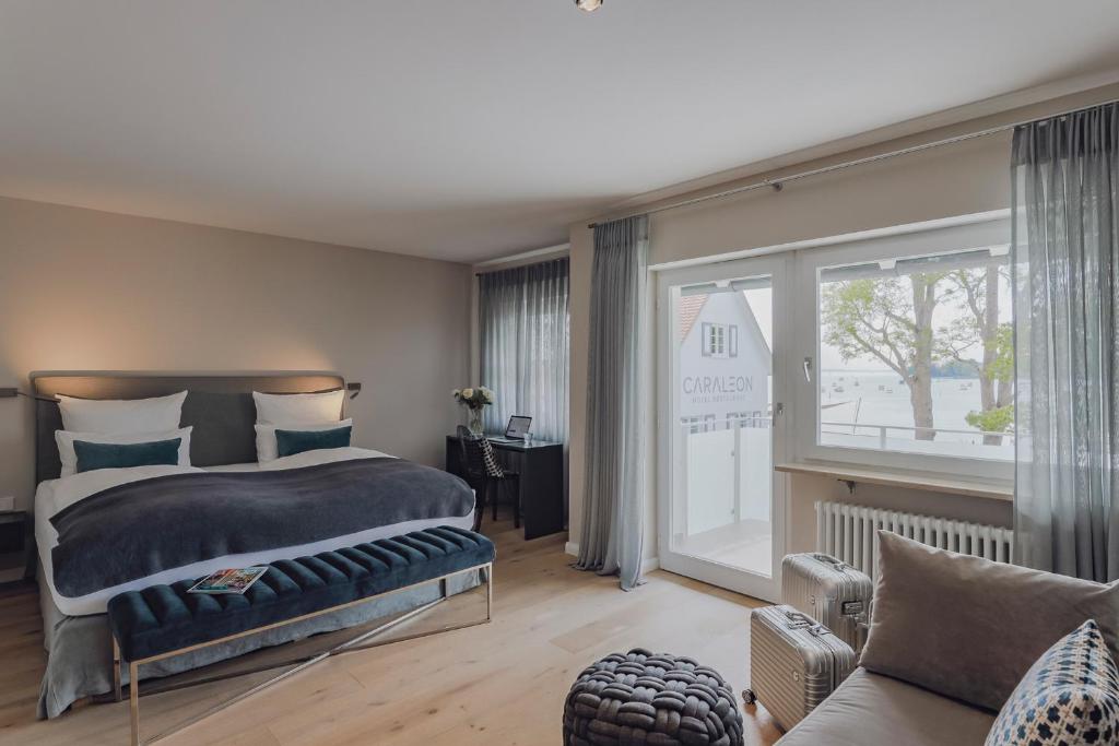 Postel nebo postele na pokoji v ubytování Hotel Caraleon