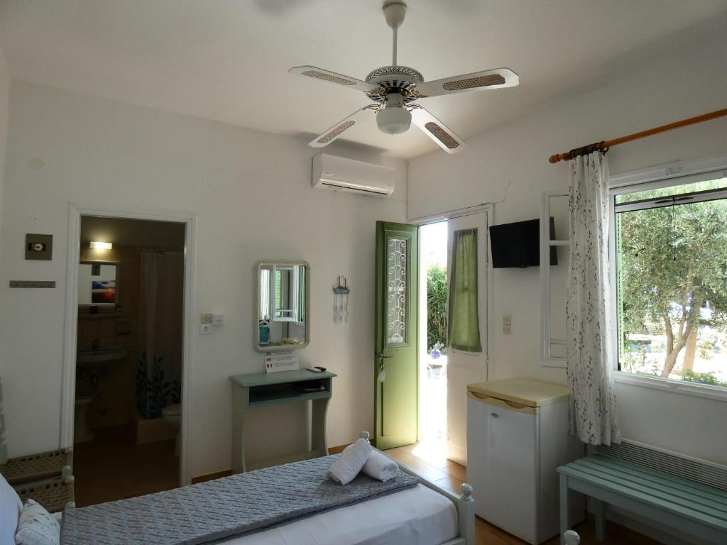 Postel nebo postele na pokoji v ubytování Το Κατἑ