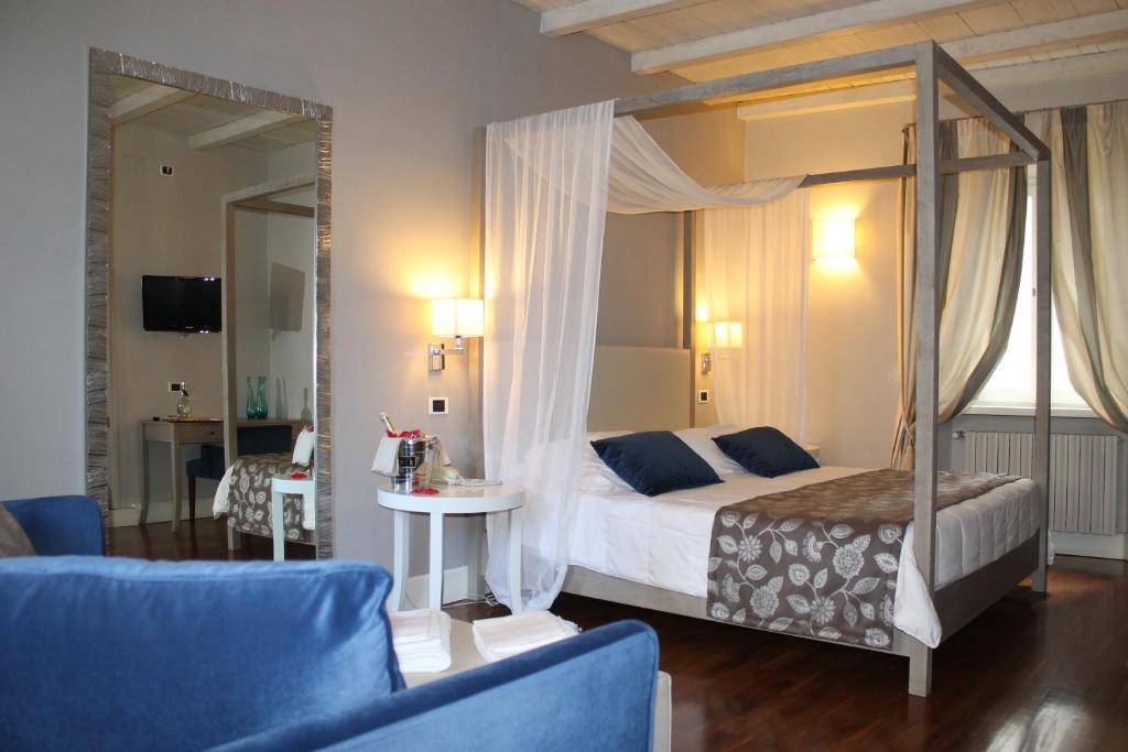 Postel nebo postele na pokoji v ubytování Hotel Charleston