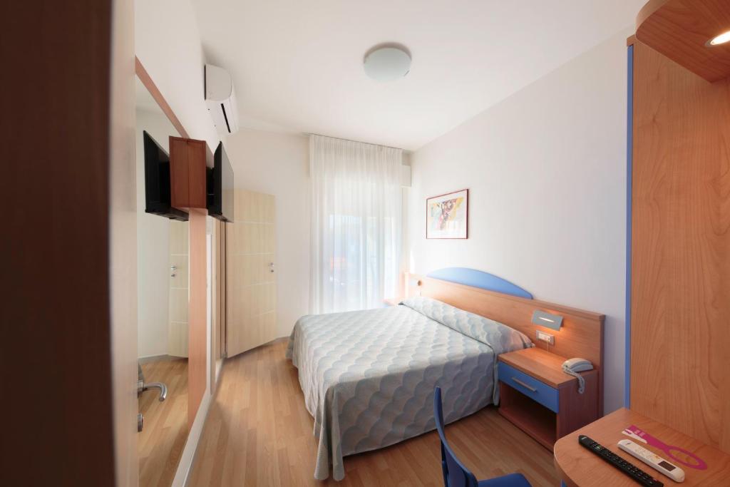 Posteľ alebo postele v izbe v ubytovaní Hotel Riviera