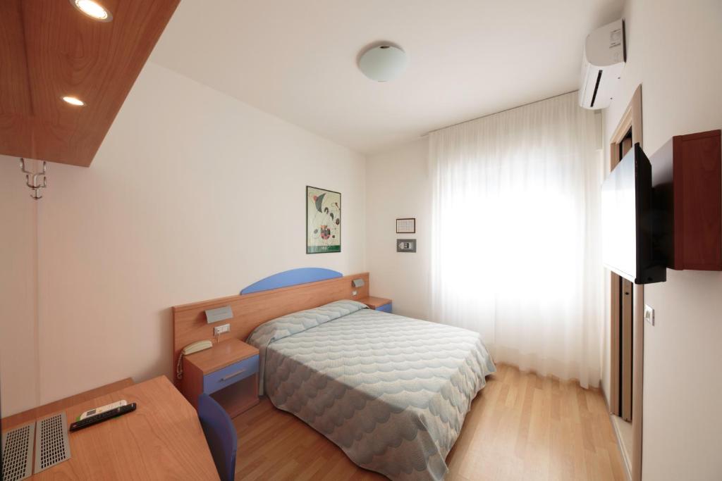 Posteľ alebo postele v izbe v ubytovaní Hotel Riviera