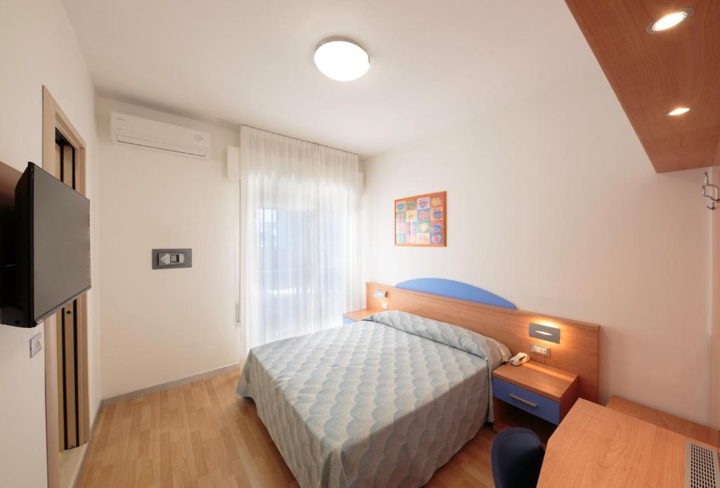 Posteľ alebo postele v izbe v ubytovaní Hotel Riviera