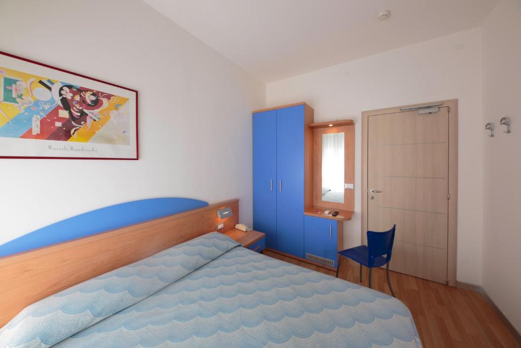 Posteľ alebo postele v izbe v ubytovaní Hotel Riviera
