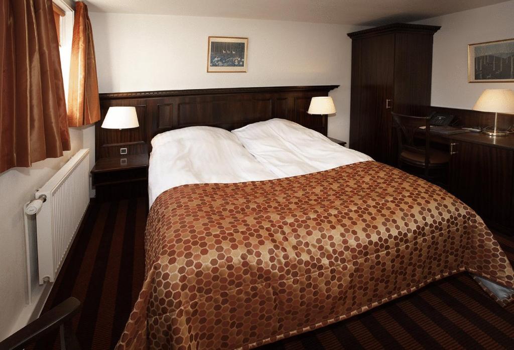 Postel nebo postele na pokoji v ubytování Hotel Kongensbro Kro