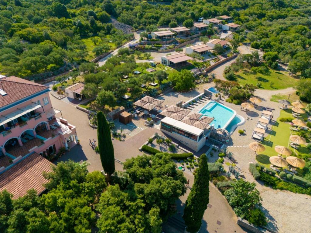 an aerial view of a resort with a pool at Holiday Homes Kanajt in Punat