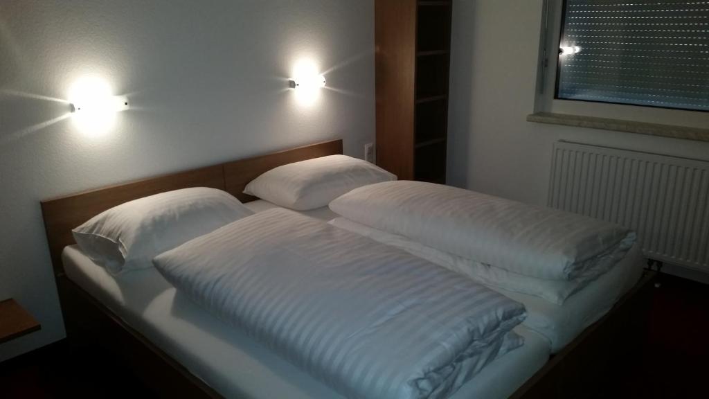 Posteľ alebo postele v izbe v ubytovaní FairSleep Motel Hainburg