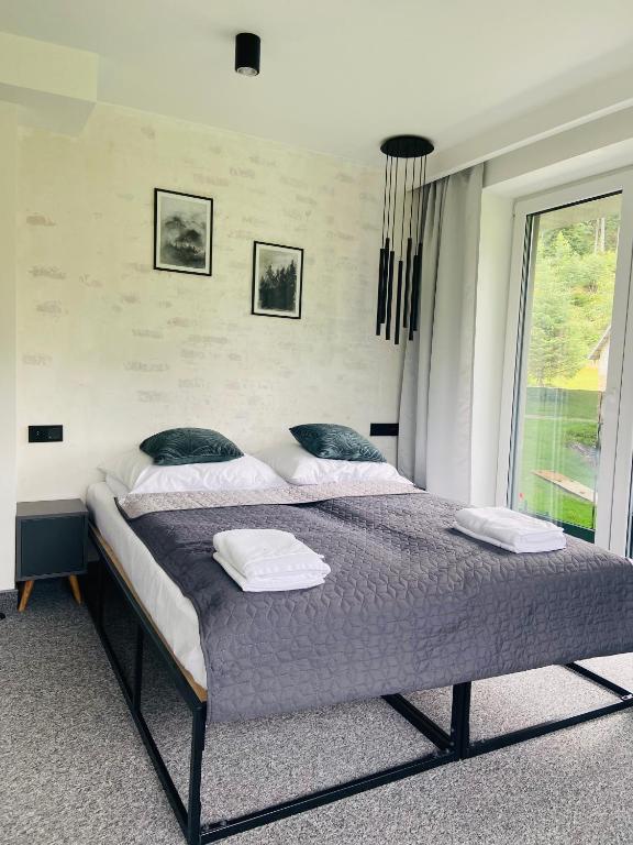 Postel nebo postele na pokoji v ubytování Villa Makuchówka