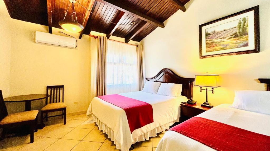 Voodi või voodid majutusasutuse Hotel Alameda toas
