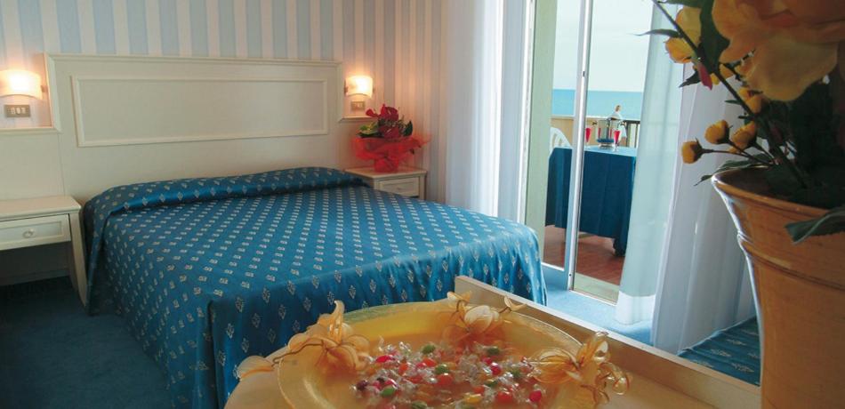 Postel nebo postele na pokoji v ubytování Hotel Foschi-Peninsula
