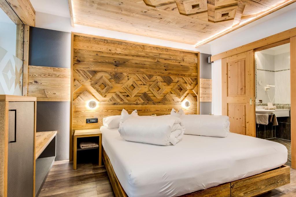Postel nebo postele na pokoji v ubytování Hotel Muliac
