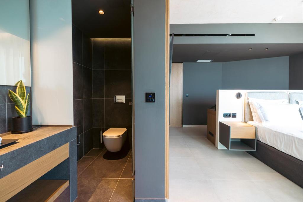 Postel nebo postele na pokoji v ubytování Anasa Luxury Resort