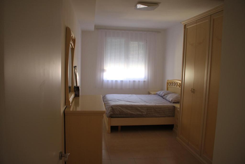 Postel nebo postele na pokoji v ubytování Everest Apartments Shengjin