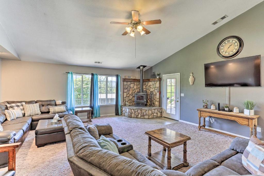 a large living room with a couch and a tv at Private Pool and Game Room Family Weaverville Gem in Weaverville