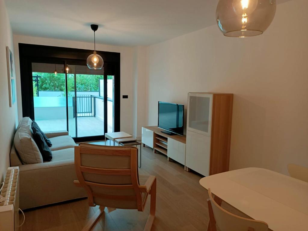 A television and/or entertainment centre at Apartamento Playa Canelas II