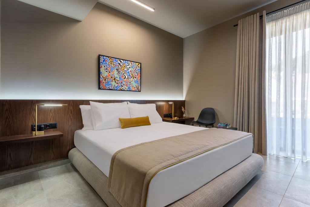 מיטה או מיטות בחדר ב-ASKLIPIOS LUXURY ROOMS