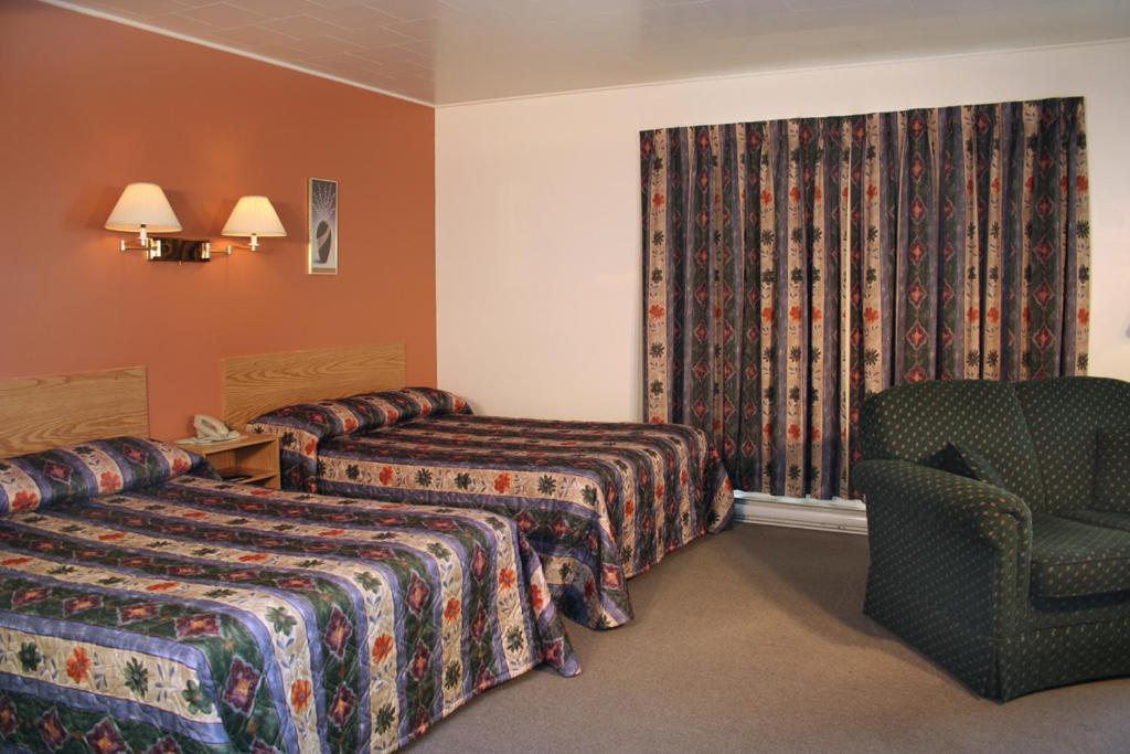 Krevet ili kreveti u jedinici u okviru objekta Motel Le Campagnard de Matane
