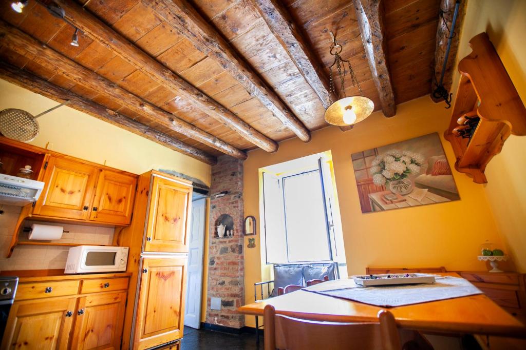 Kuchyň nebo kuchyňský kout v ubytování Casa di MOMO