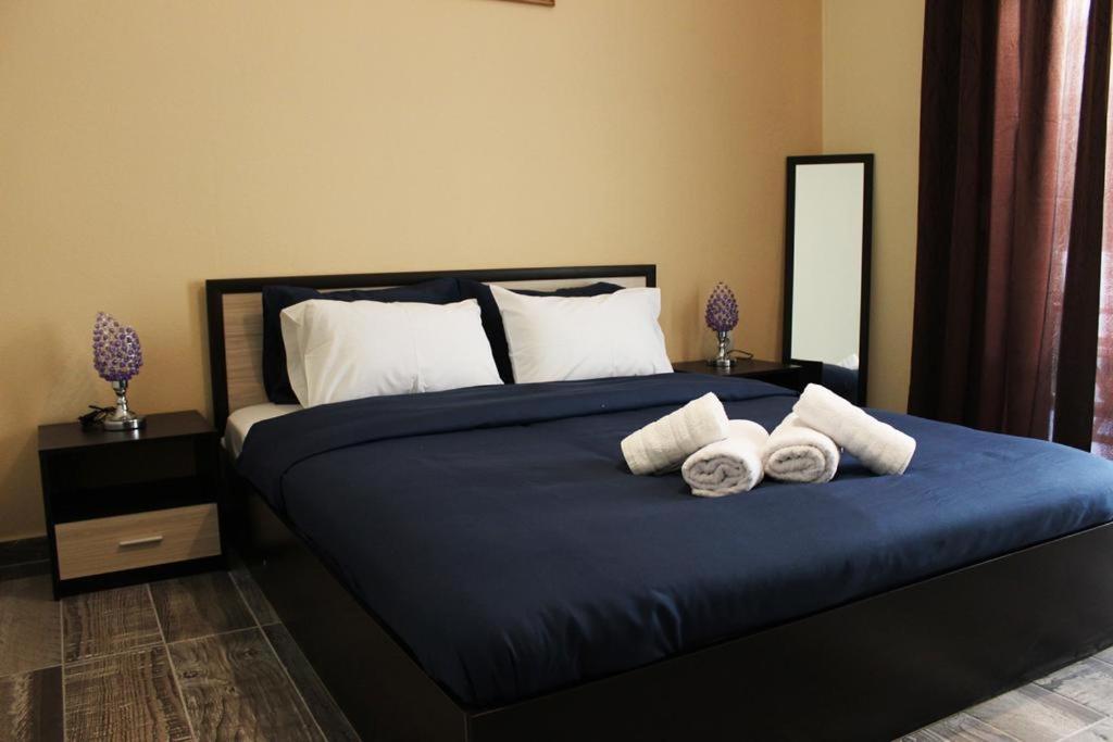 Posteľ alebo postele v izbe v ubytovaní Globy SeaView Apartments Kavala