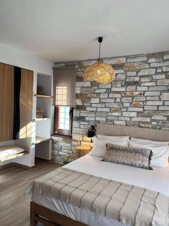 Postel nebo postele na pokoji v ubytování Peri Elxis Luxury Suites