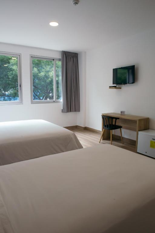 Postel nebo postele na pokoji v ubytování The Park Hotel