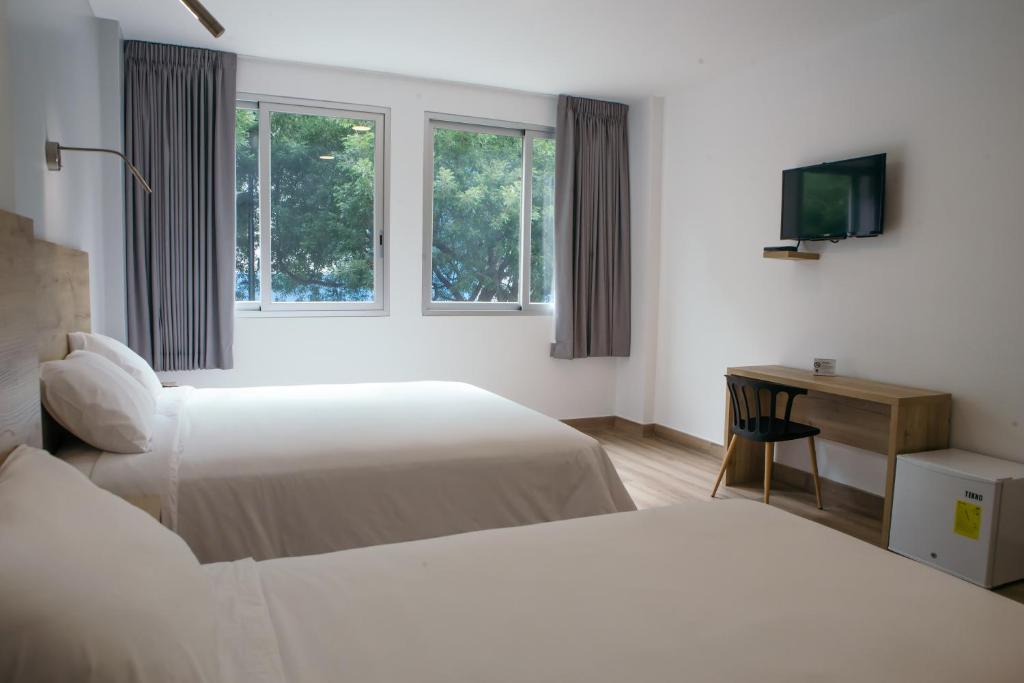 Postel nebo postele na pokoji v ubytování The Park Hotel