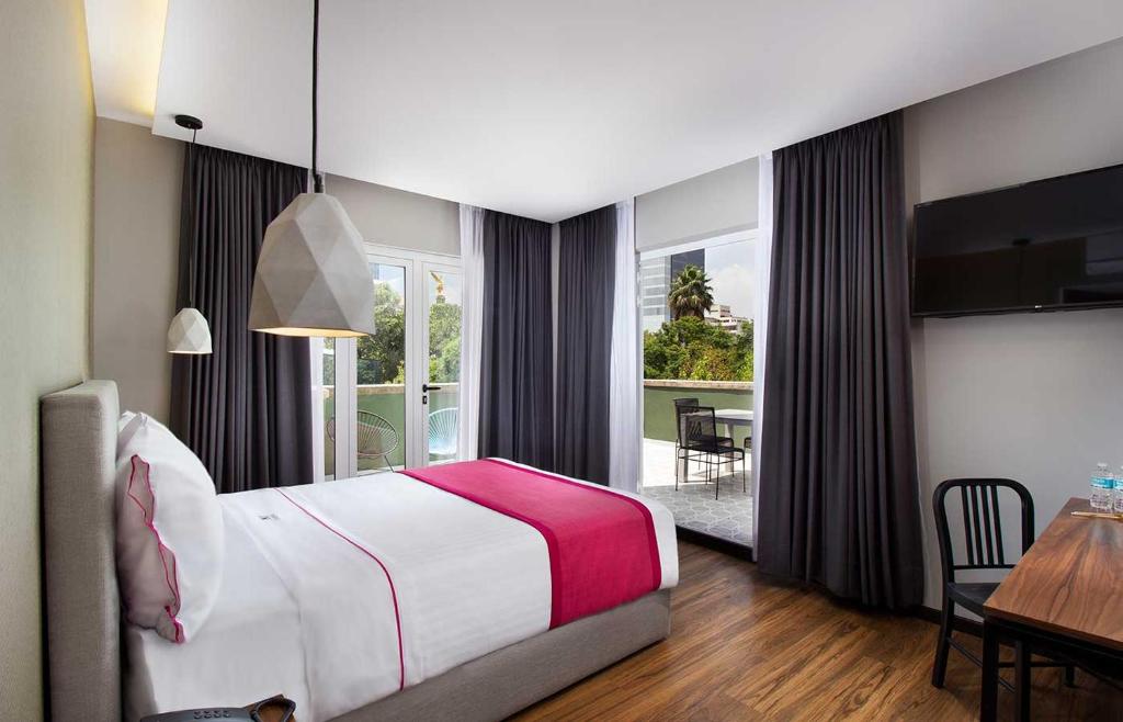 Кровать или кровати в номере Hotel MX más reforma