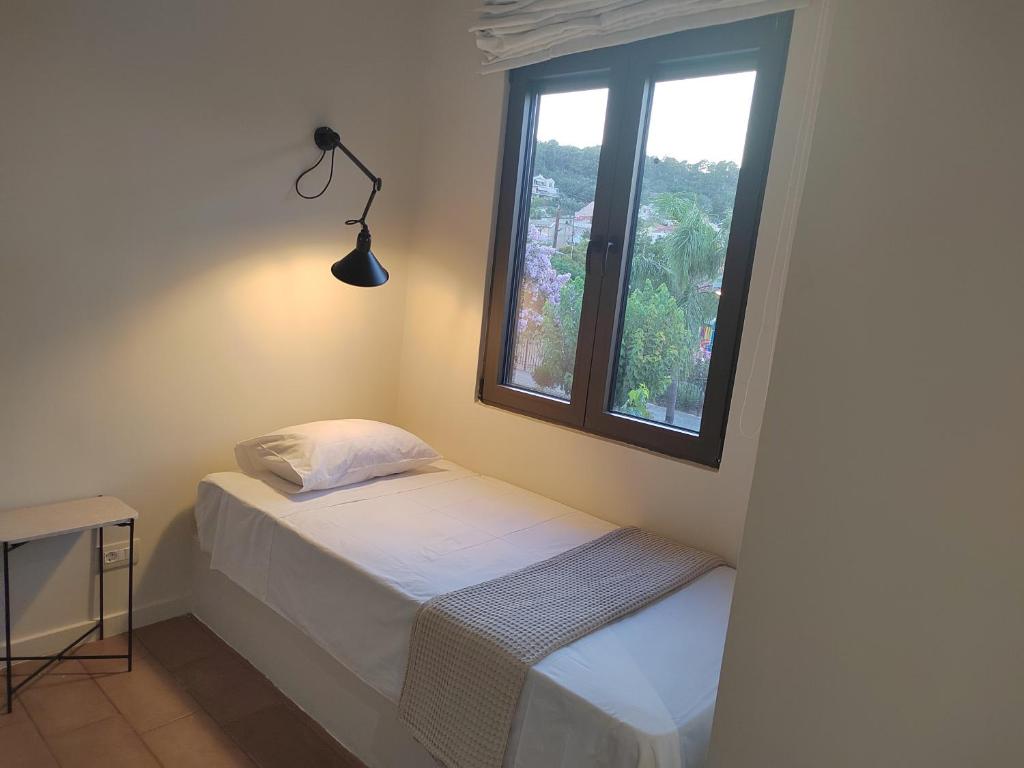 Postel nebo postele na pokoji v ubytování Yasemi
